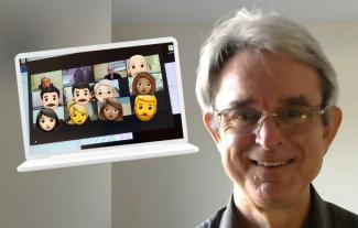 A man smiling, next to a laptop displaying a group video call in progress