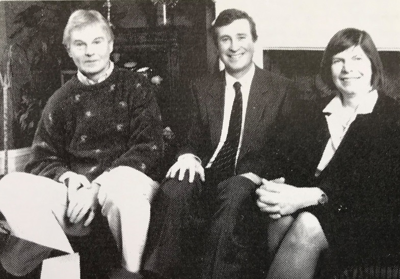 Two men, one of them the actor Derek Jacobi, and a woman, the author Margaret Drabble, seated, looking at the camera